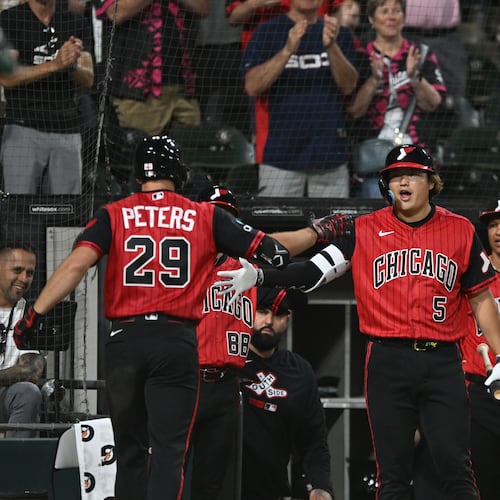 Chicago White Sox's Tristan Peters (29) celebrates with teammate Munetaka Murakami (5) at the dugout after hitting a two-run home run during the seventh inning of a baseball game against The Athletics in Chicago, Friday, July 10, 2026. (AP Photo/Paul Beaty)