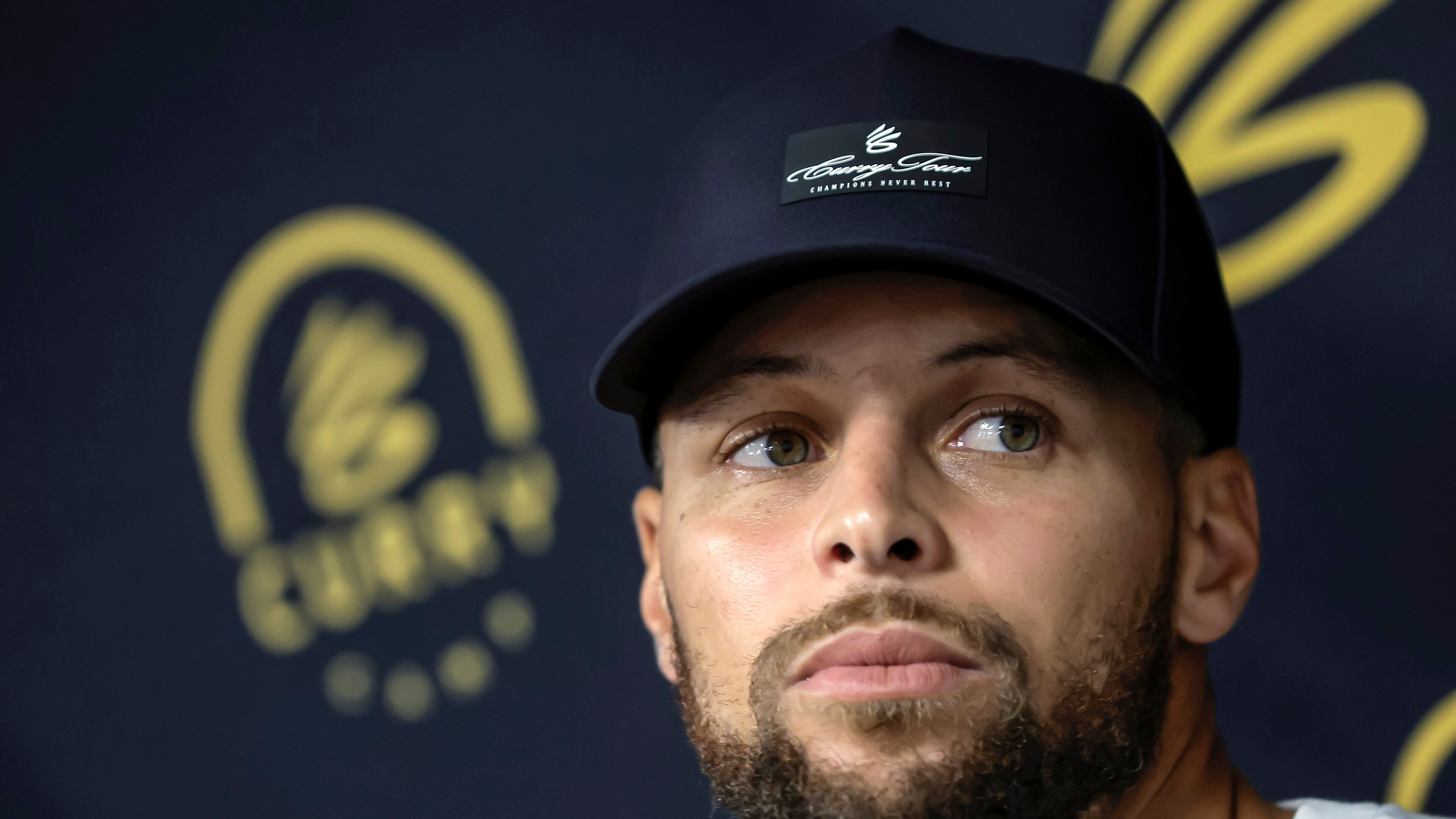 Golden State Warriors' Stephen Curry answers questions from reporters during a break from his Under Armour Camp at Arrillaga Family Gym in Menlo Park, Calif., on Thursday, Aug. 14, 2025. (Carlos Avila Gonzalez/San Francisco Chronicle via AP)
