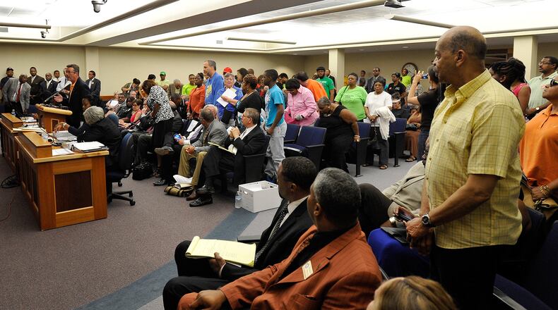 Clayton County residents stand to voice support of MARTA at a July 2014 meeting.