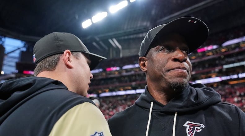 Atlanta Falcons head coach Raheem Morris, right, greets New Orleans Saints head coach Kellen Moore after an NFL football game, Sunday, Jan. 4, 2026, in Atlanta. (Brynn Anderson/AP)
