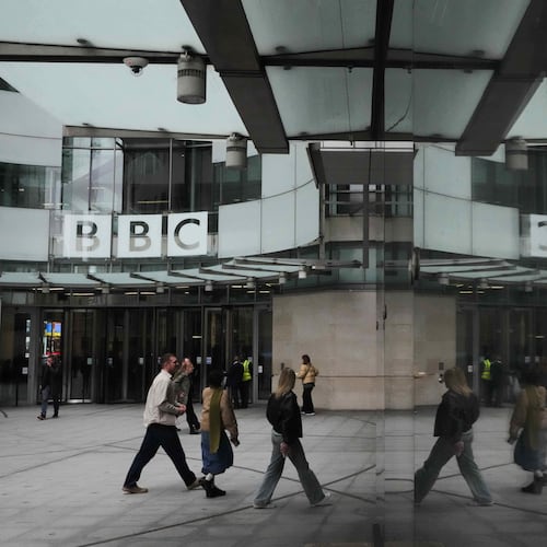FILE - Pedestrians are reflected as they walk outside BBC Broadcasting House in London, Tuesday, Nov. 11, 2025. (AP Photo/Kirsty Wigglesworth, file)