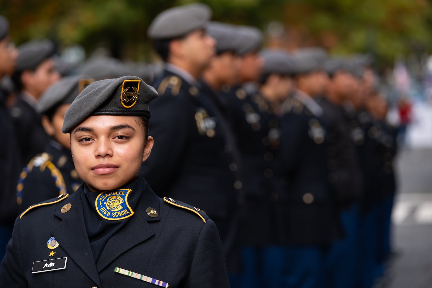 Alisa Avila lines up with the Chamblee High School Army JROTC before the Georgia Veterans Day Parade in Midtown Atlanta on Saturday, Nov. 8, 2025.   Ben Gray for the Atlanta Journal-Constitution