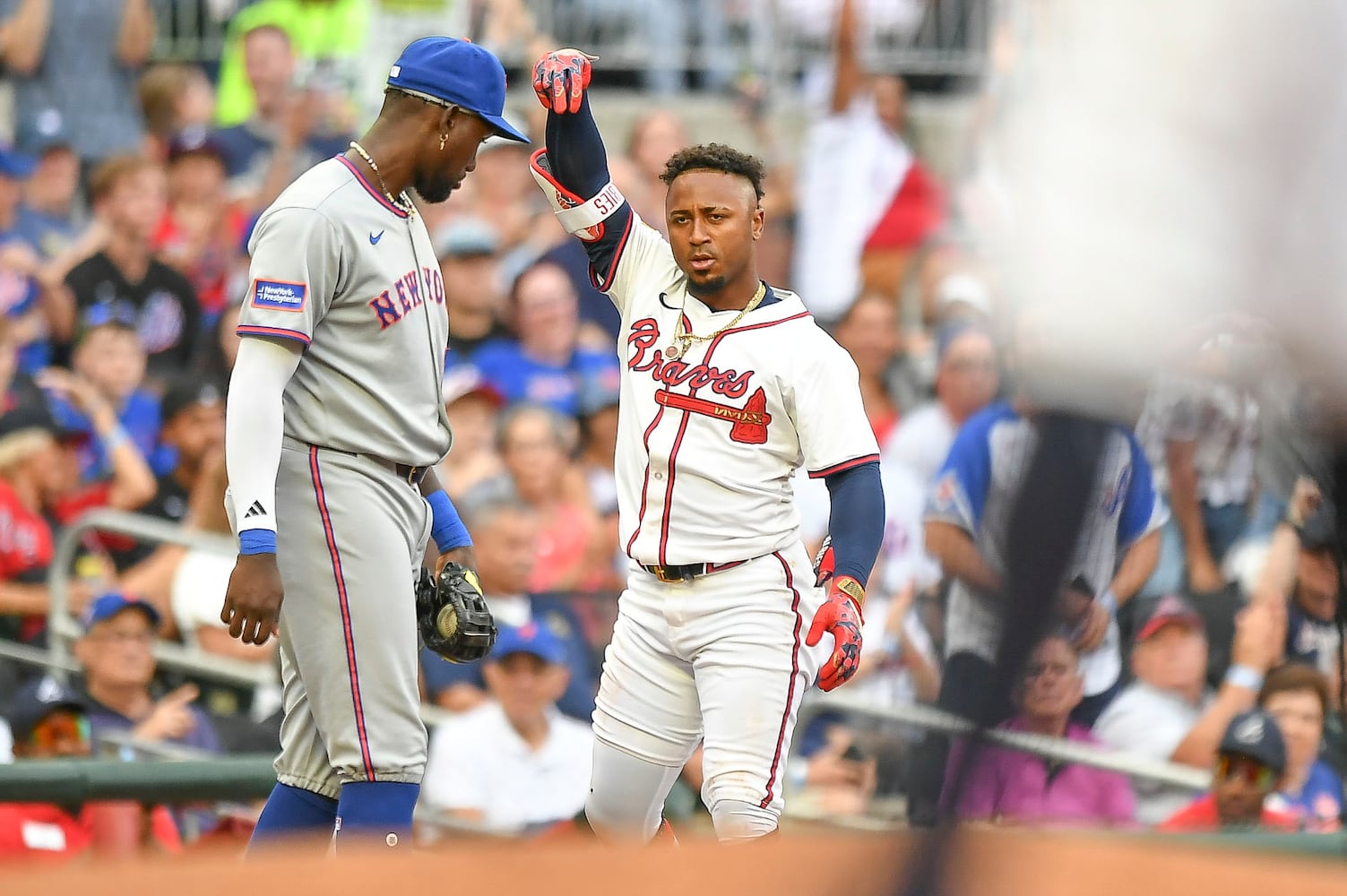 Atlanta Braves second base Ozzie Albies (1) gestures after tripling to third base against the New York Mets during a MLB game Wednesday, June 18, 2025 at Truist Park. (Daniel Varnado/For the Atlanta Journal-Constitution)