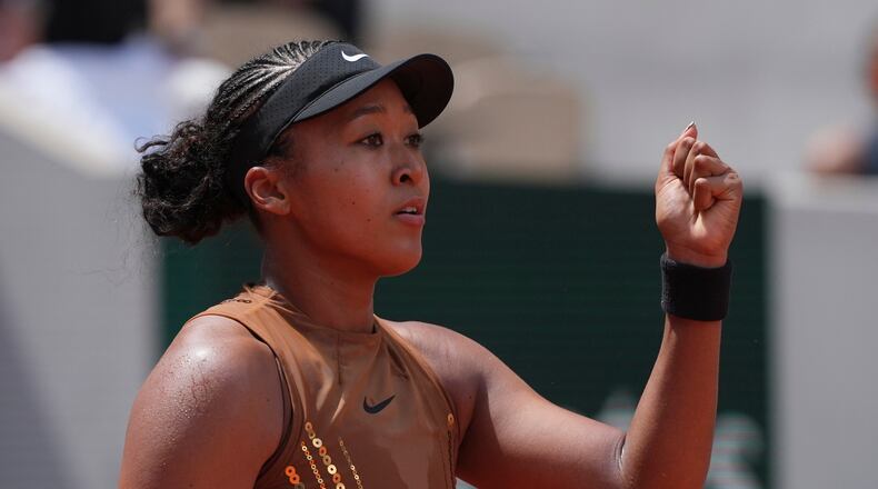 Naomi Osaka of Japan celebrates winning the third round women's singles tennis match against against Iva Jovic of the U.S. at the French Open tennis tournament in Paris, Saturday, May 30, 2026. (AP Photo/Thibault Camus)