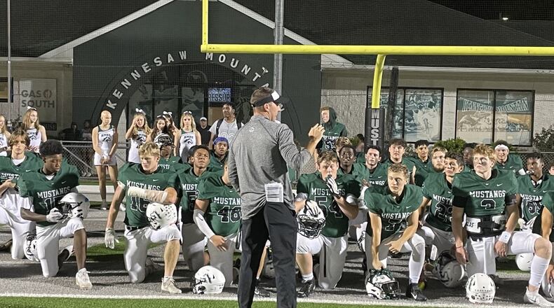Kennesaw Mountain head coach Caleb Carmean talks to his team after its 47-3 victory over Sprayberry on Sept. 10, 2021 (Photo by Chip Saye)