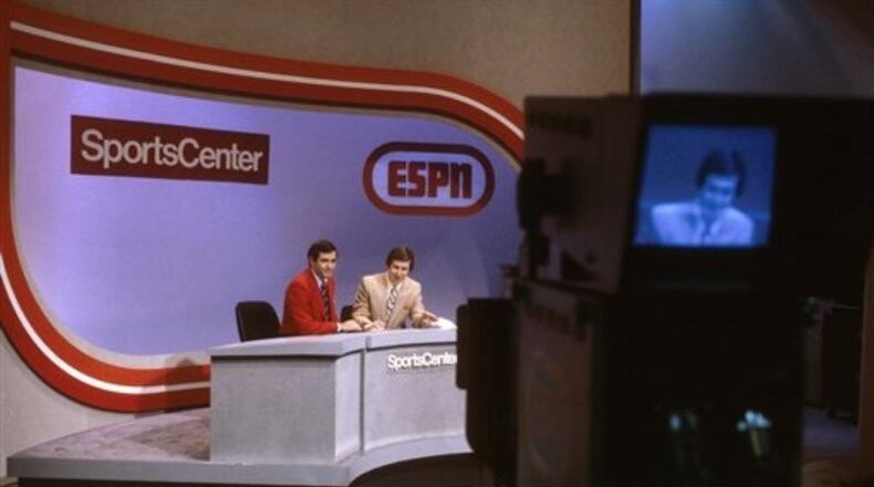 Bob Ley, right, and George Grande were anchors when ESPN debuted in 1979. Ley announced he is retiring after 40 years with the sports cable network.