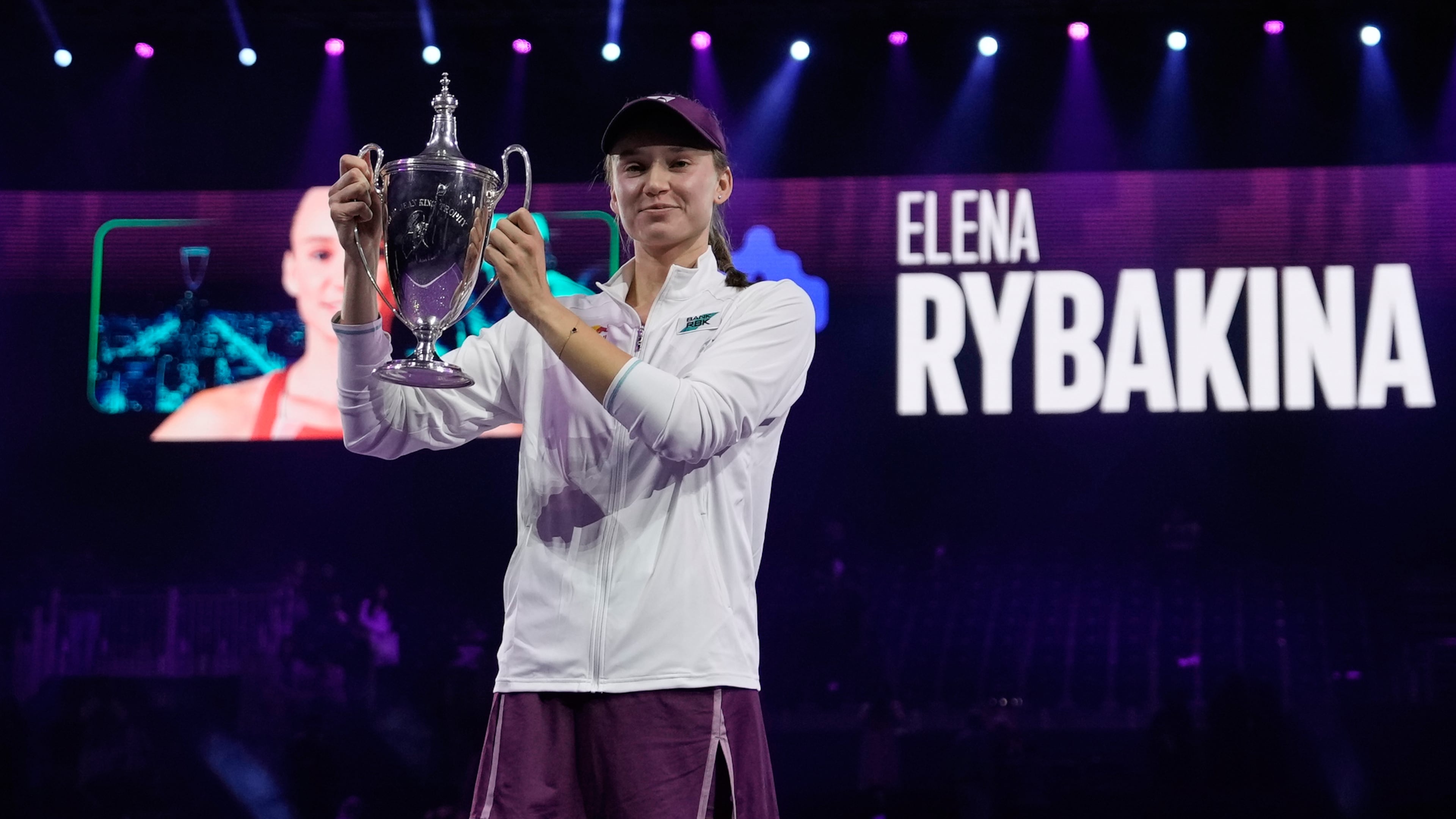 Elena Rybakina of Kazakhstan poses with the trophy after defeating Aryna Sabalenka of Belarus in the women's final singles match of the WTA finals in Riyadh, Saudi Arabia, Saturday, Nov. 8, 2025. (AP Photo/ Fatima Shbair)