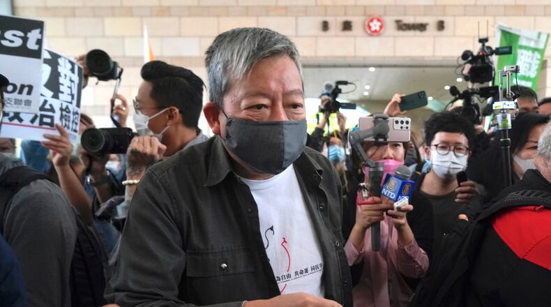 FILE - Pro-democracy activist Lee Cheuk-yan, center, arrives at a court in Hong Kong, April 16, 2021. (AP Photo/Kin Cheung, File)
