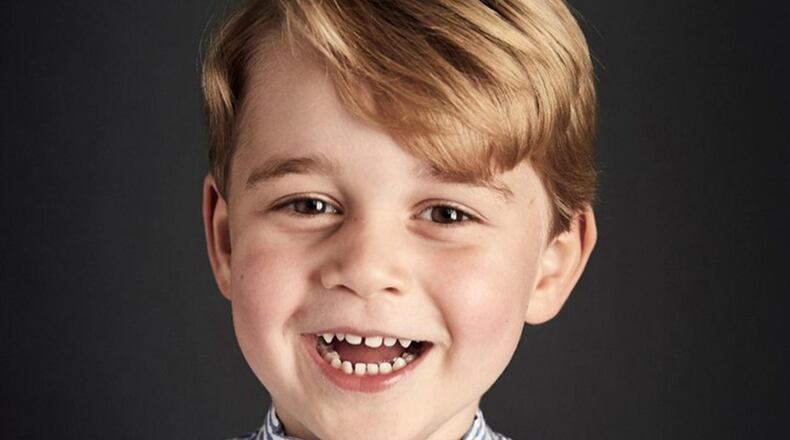 Prince George smiles for his fourth birthday pictures.