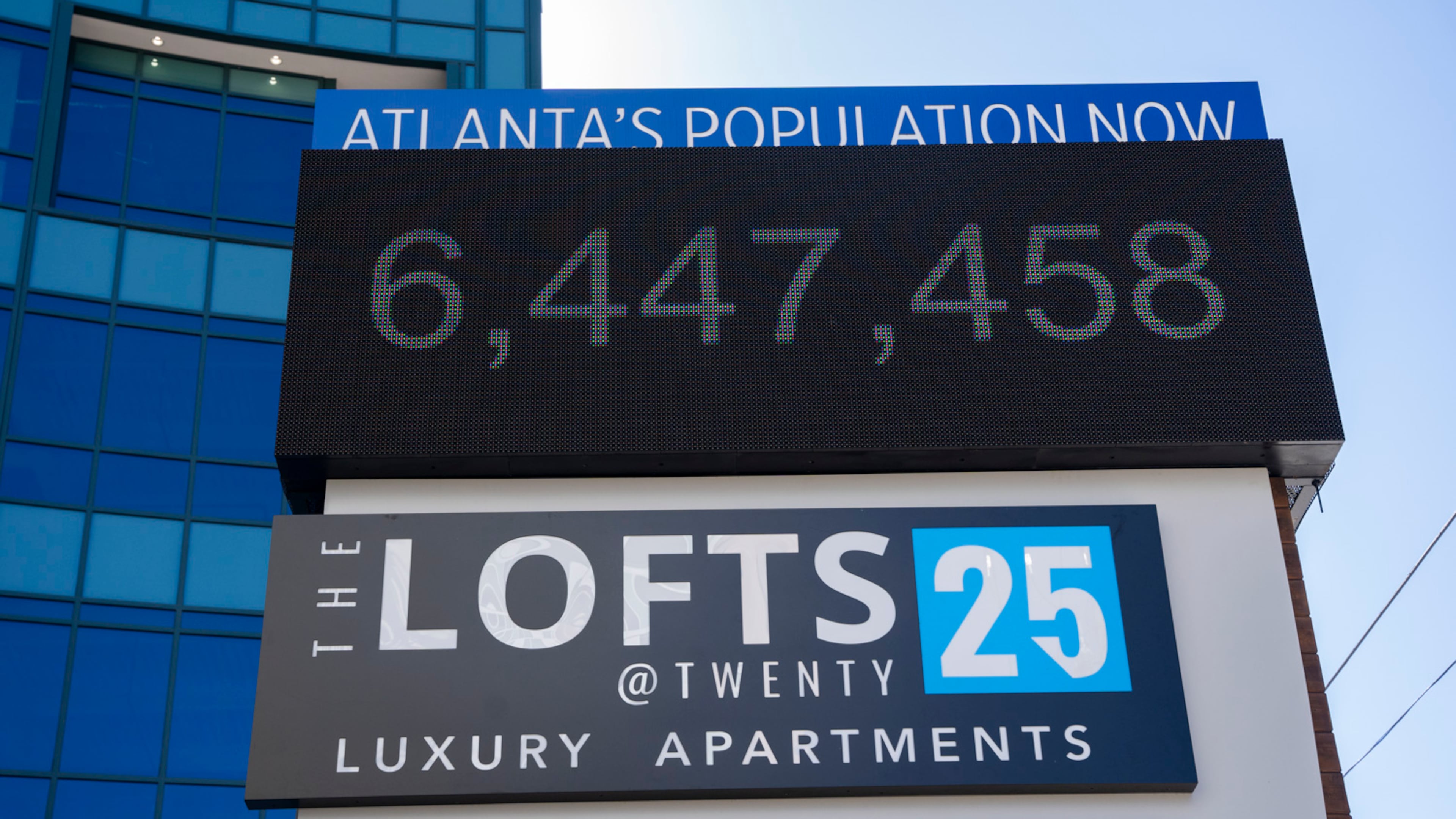 A sign outside the the Lofts at Twenty25 apartment complex displays the current population of Atlanta on Wednesday, Feb. 14, 20204. (Olivia Bowdoin for the AJC).
