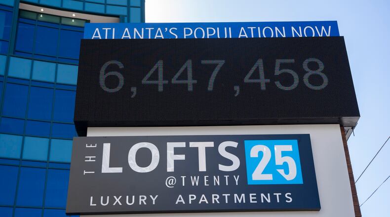 A sign outside the the Lofts at Twenty25 apartment complex displays the current population of Atlanta on Wednesday, Feb. 14, 2024. (Olivia Bowdoin for the AJC).