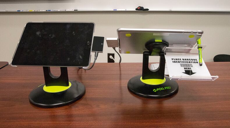 Voters check in at their precincts with an iPad that scans their driver's license or other form of photo ID when using the new Georgia voting machines, as shown at a demonstration at the James H. "Sloppy" Floyd building in Atlanta, Sept. 16, 2019. (Alyssa Pointer/alyssa.pointer@ajc.com)