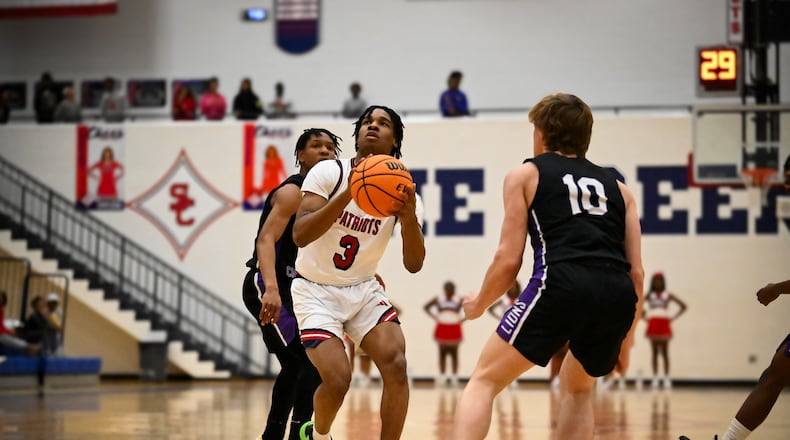 Sandy Creek's Jared White makes a move on the basket during a regular-season game. White was the Region 2-3A Player of the Year. (Photo - Tammy McCracken)