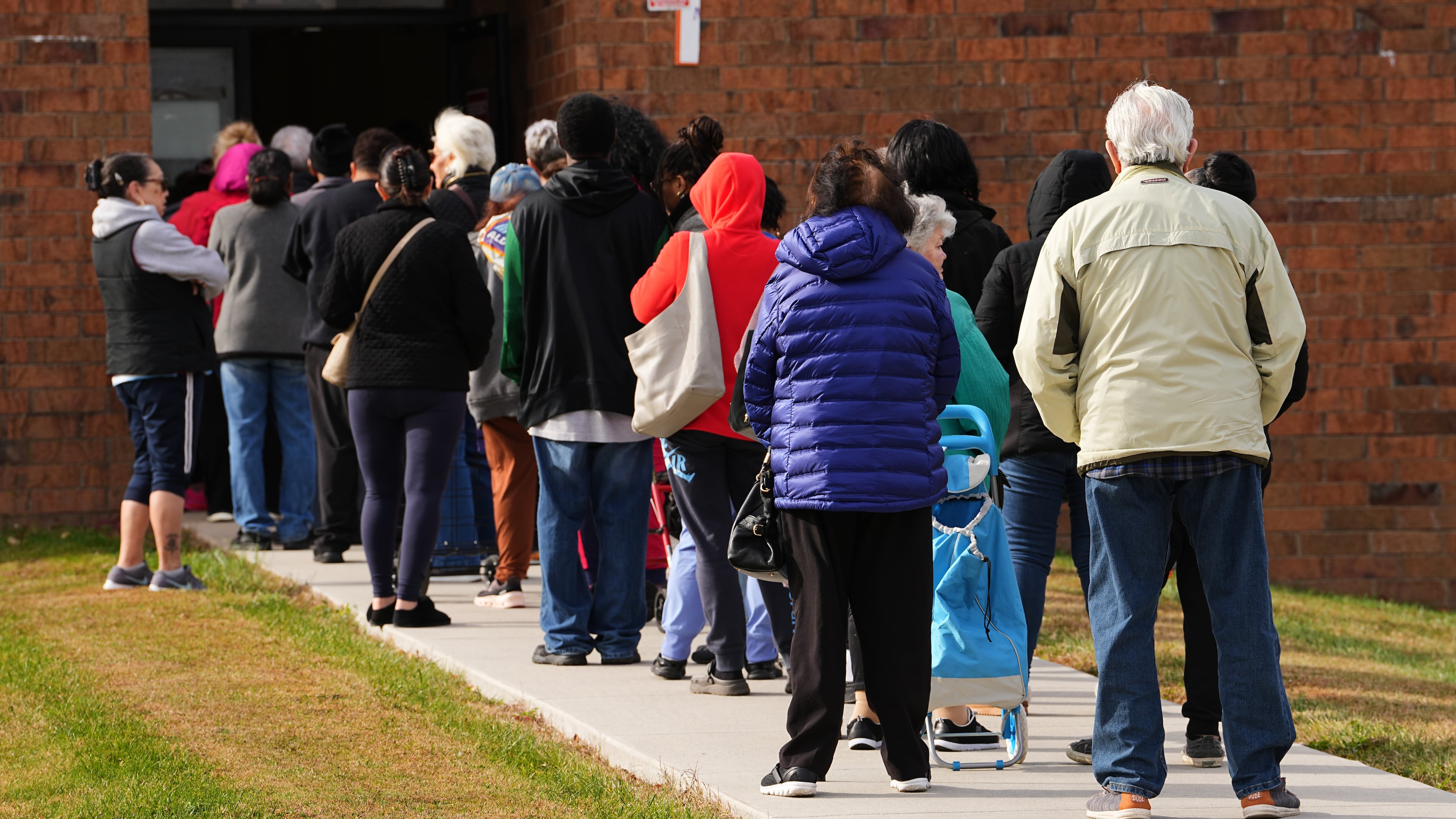 People wait in line durning an emergency food distribution at The Jewish Federation of Greater Philadelphia's Mitzvah Food Program in Philadelphia, Friday, Nov. 7, 2025. (AP Photo/Matt Rourke)