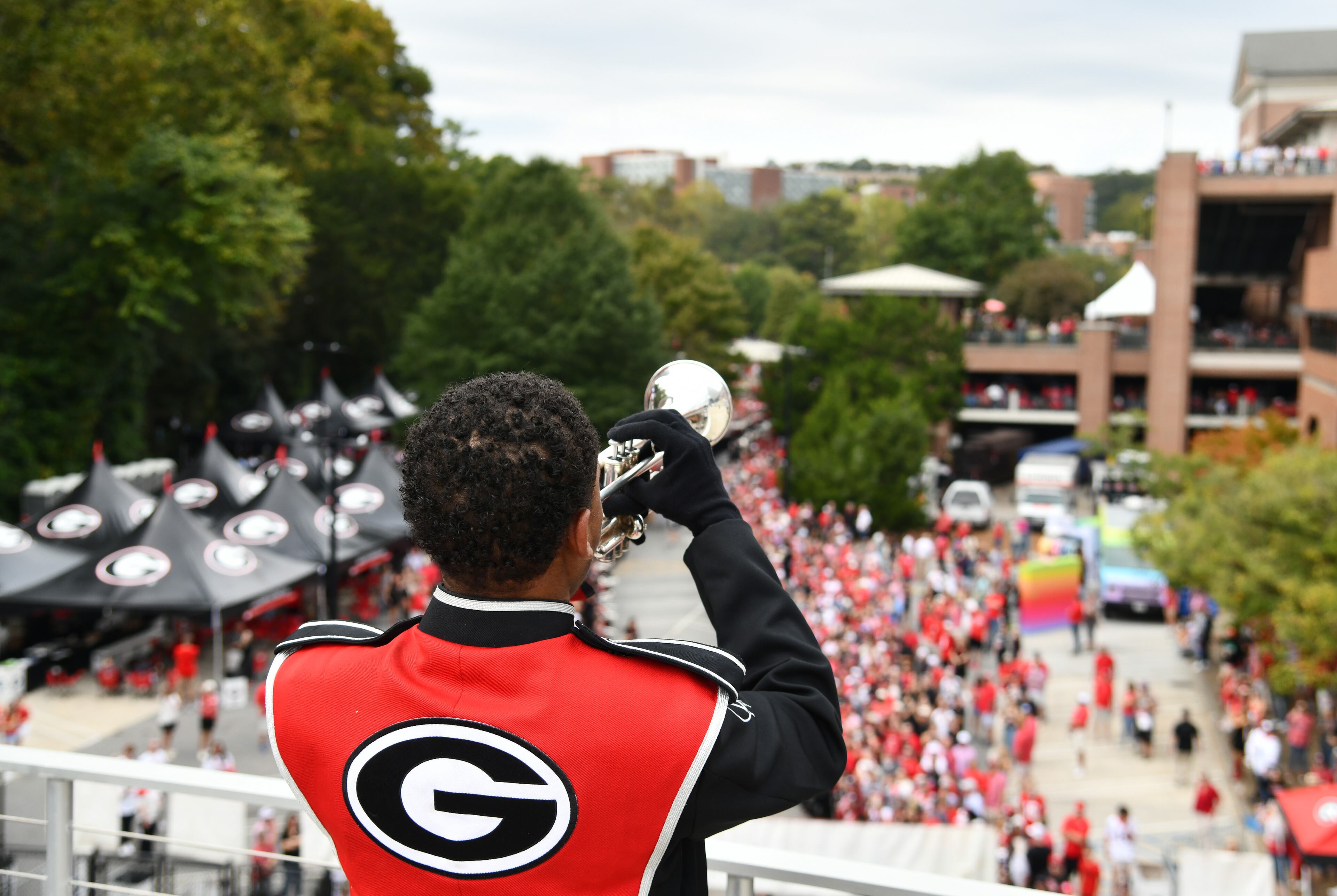 Georgia trumpeter Justin Arnold performs as players and coaching staff arrive during the Dawg Walk before an NCAA football game against Mississippi at Sanford Stadium, Saturday, October 18, 2025, in Athens. (Hyosub Shin/AJC)