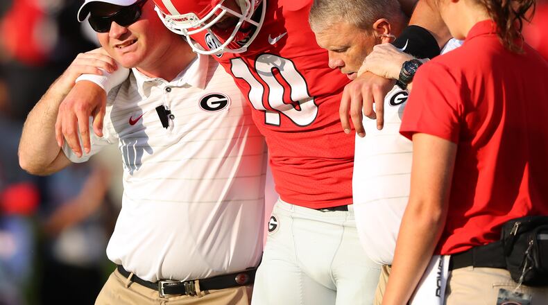 September 2, 2017 Athens: Georgia quarterback Jacob Eason is injured and leaves the game during the first quarter against Appalachian State in a NCAA college football game on Saturday, September 2, 2017, in Athens.    Curtis Compton/ccompton@ajc.com