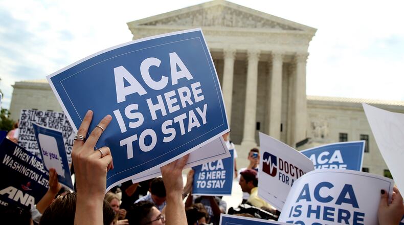 Demonstrators outside the Supreme Court in June 2015, celebrating the court's decision in King v. Burwell, which concerned a dispute over the tax credits used on the insurance exchanges. (Doug Mills/The New York Times)