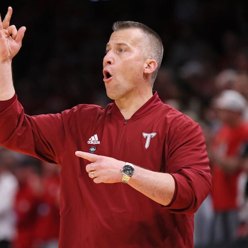 Troy head coach Scott Cross signals his team during the second half against Nebraska in the first round of the NCAA college basketball tournament, Thursday, March 19, 2026, in Oklahoma City. (AP Photo/Nate Billings)