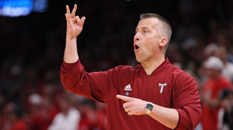 Troy head coach Scott Cross signals his team during the second half against Nebraska in the first round of the NCAA college basketball tournament, Thursday, March 19, 2026, in Oklahoma City. (AP Photo/Nate Billings)