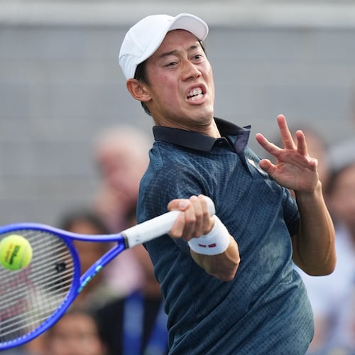 Kei Nishikori, of Japan, returns the ball to Michael Antonius, of the United States, during a qualifying match at the U.S. Open tennis championships Wednesday, Aug. 26, 2026, in New York. (AP Photo/Frank Franklin II)