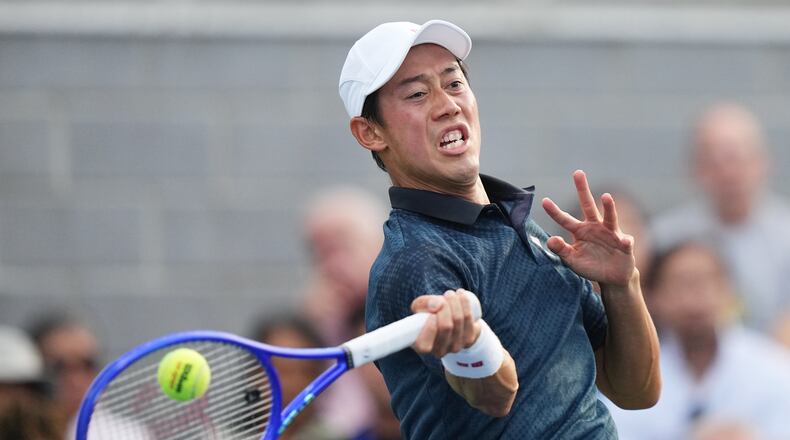 Kei Nishikori, of Japan, returns the ball to Michael Antonius, of the United States, during a qualifying match at the U.S. Open tennis championships Wednesday, Aug. 26, 2026, in New York. (AP Photo/Frank Franklin II)