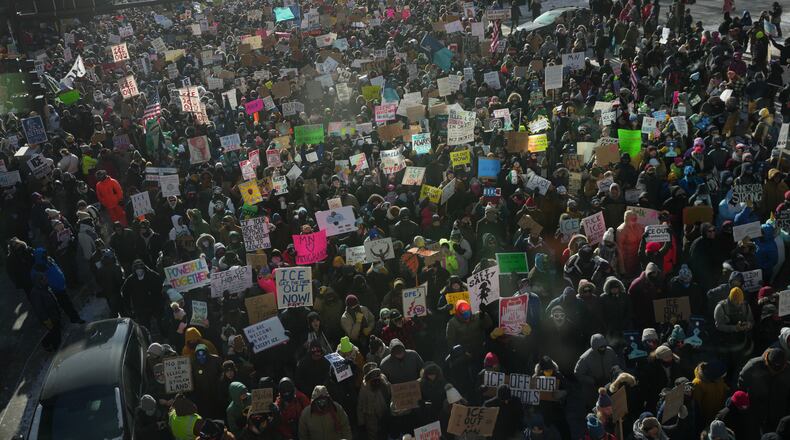 People protest against Federal immigration agents on Friday, Jan. 23, 2026, in Minneapolis. (AP Photo/Angelina Katsanis)