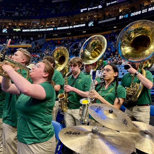 The North Dakota State pep band plays for the Bison’s NCAA Tournament game against Michigan State at KeyBank Center on Thursday, March 19, 2026, in Buffalo, N.Y. Linnea Hagestuen (foreground) plays the mellophone while alto saxophonist Stanaha’ Fox plays behind her. (Ken Sugiura/AJC)