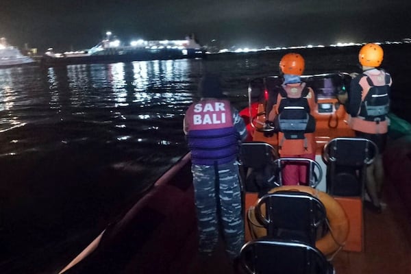 In this photo released by the Indonesian National Search and Rescue Agency (BASARNAS) rescuers search for victims after a ferry enroute for the resort island of Bali sank off Ketapang, East Java, Indonesia, early Thursday, July 3, 2025. (BASARNAS via AP)