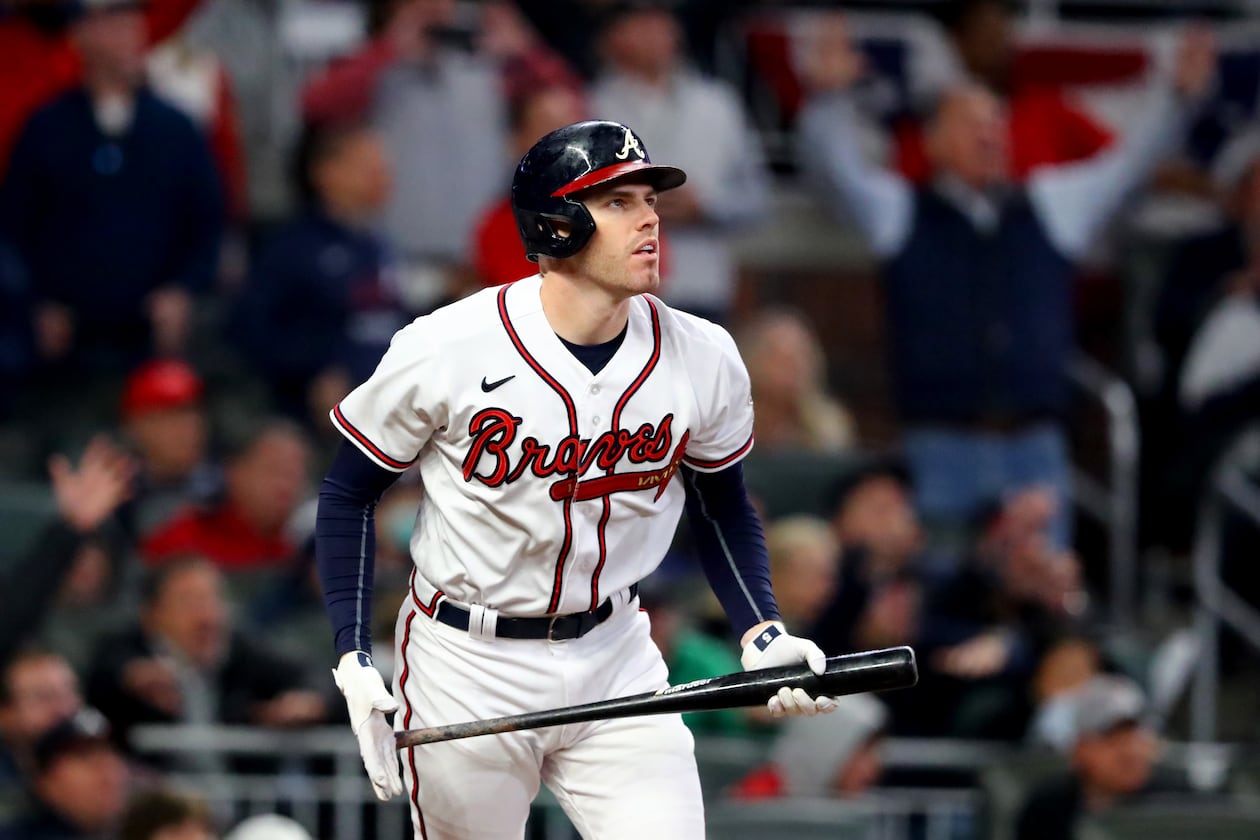 First baseman Freddie Freeman, pictured during the 2021 World Series with the Braves, has over 2,500 hits and is approaching 400 home runs in his career. The looming debate is whether he would represent the Braves or Dodgers – or neither – on a Hall of Fame plaque. (Curtis Compton/AJC)