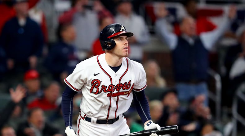First baseman Freddie Freeman, pictured during the 2021 World Series with the Braves, has over 2,500 hits and is approaching 400 home runs in his career. The looming debate is whether he would represent the Braves or Dodgers – or neither – on a Hall of Fame plaque. (Curtis Compton/AJC)