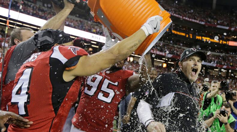 Atlanta Falcons head coach Dan Quinn reacts as he is dunked after the NFL football NFC championship game against the Green Bay Packers Sunday, Jan. 22, 2017, in Atlanta. The Falcons won 44-21 to advance to Super Bowl LI. (AP Photo/Mark Humphrey)