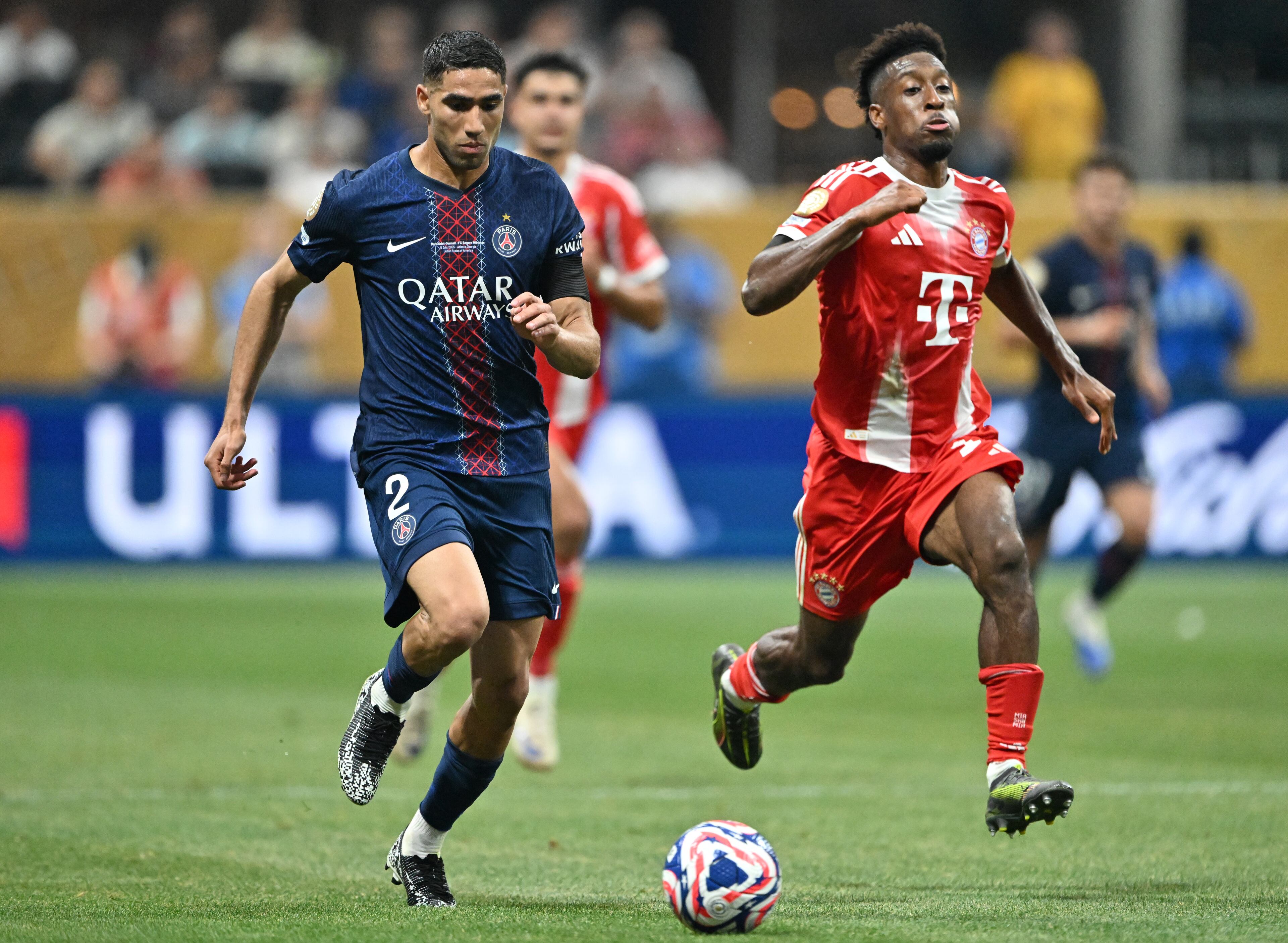 Paris Saint-Germain defender Achraf Hakimi (2) works the ball against Bayern Munich goalkeeper Manuel Neuer (right) during the second half in Club World Cup quarterfinals match at Mercedes-Benz Stadium, Saturday, July 5, 2025, in Atlanta. Paris Saint-Germain won 2-0 over Bayern Munich. (Hyosub Shin / AJC)