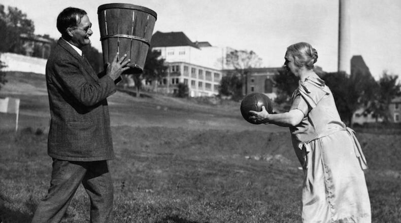 FILE -- James Naismith, with his wife, Maude, in 1928, practicing basketball, which he invented for YMCA students in Springfield, Mass., in 1891. In a recording of Naismith from an interview in 1939, recently found in the Library of Congress archives, Naismith reminisces about the first basketball game, played at what is now Springfield College by students forced inside by the winter weather. (The New York Times)