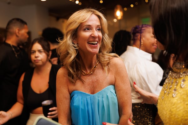 Carrie Hadley, owner of Indiehouse Modern Fragrances, mingles with attendees during an artificial intelligence-powered perfume event at Phipps Plaza in Atlanta on Wednesday, June 3, 2026. The perfume store makes it possible for customers to create custom scents from the help of an AI robot machine. (Estela Muñoz/AJC)