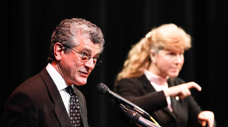 Evans Mirageas, Harry T. Wilks Artistic Director of Cincinnati Opera, shares memories of Harry T. Wilks during a memorial service held Saturday, March 29, 2014, to celebrate his life at Miami University Hamilton's Parrish Auditorium. NICK DAGGY / COX NEWSPAPERS