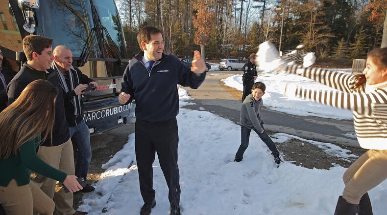 Daniella Rubio (R) throws a snowball at her father, Republican presidential candidate U.S. Sen. Marco Rubio, R-Fla., after a town hall meeting in Hudson, N.H., on Sunday. Chip Somodevilla/Getty Images