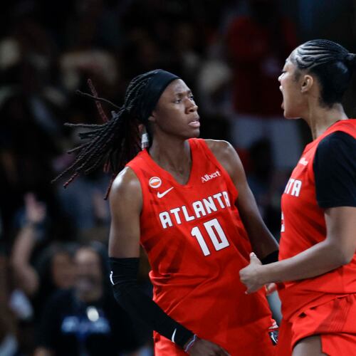 Atlanta Dream forward Angel Reese (5) celebrates with teammate Atlanta Dream guard Rhyne Howard (10) after Howard scores a three-pointer in the second half of a WNBA game against the Minnesota Lynx at Gateway Center Arena on Sunday, August 30, 2026, in Atlanta. (Miguel Martinez/ AJC)