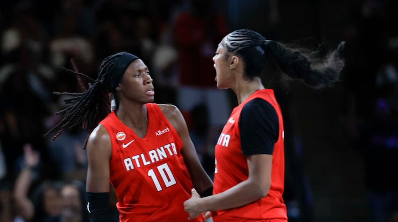 Atlanta Dream forward Angel Reese (5) celebrates with teammate Atlanta Dream guard Rhyne Howard (10) after Howard scores a three-pointer in the second half of a WNBA game against the Minnesota Lynx at Gateway Center Arena on Sunday, August 30, 2026, in Atlanta. (Miguel Martinez/ AJC)