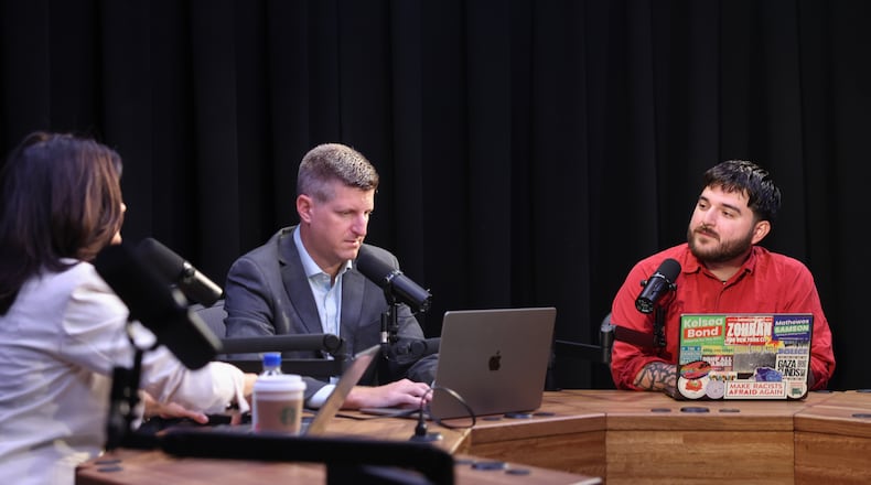 (From left) AJC’s Patricia Murphy and Greg Bluestein prepare for a "Politically Georgia" podcast recording with Brayan Ramirez, co-chair of the Atlanta Democratic Socialists of America (DSA), at the AJC office in Atlanta on Aug. 31, 2026. (Arvin Temkar/AJC)
