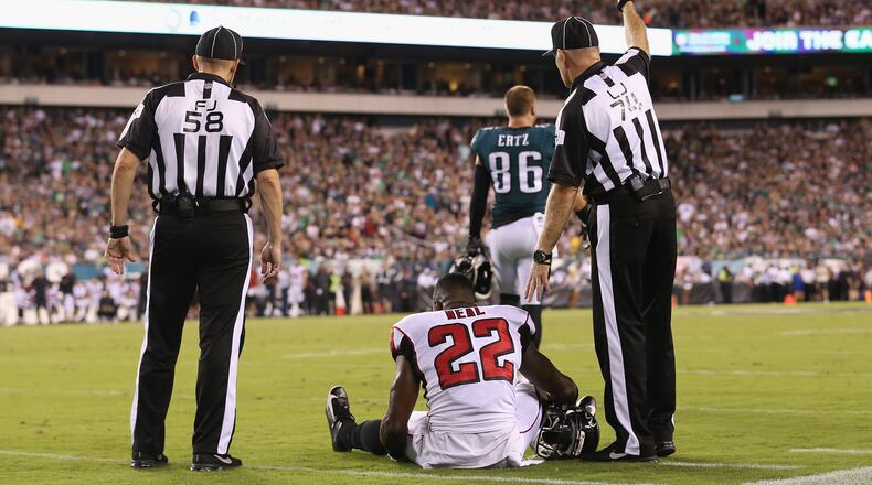 Falcons safety Keanu Neal sits on the ground after suffering a knee injury during the first half Thursday, Sept. 6, 2018, against the Philadelphia Eagles at Lincoln Financial Field in Philadelphia.
