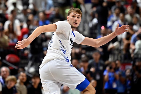 Dallas Mavericks forward Cooper Flagg (32) looks back as he runs up court against the Los Angeles Lakers during the first half of an NBA summer league basketball game Thursday, July 10, 2025, in Las Vegas. (AP Photo/David Becker)