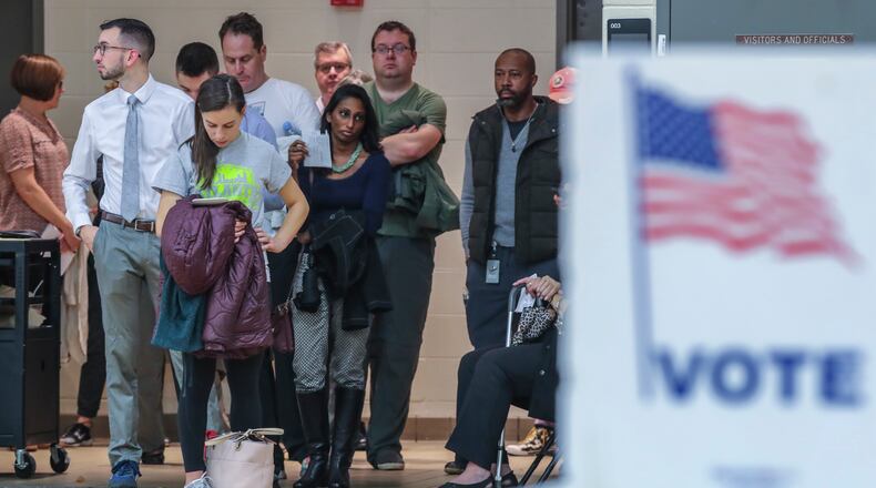 Voters waited over an hour to vote at Henry W. Grady High School on Tuesday Nov. 6, 2018. Metro Atlanta polling places reported steady lines as voters went to the polls Tuesday. JOHN SPINK/JSPINK@AJC.COM
