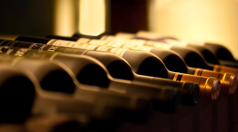 Roswell rigid on sidewalk tables allows it for champagne bar beside Canton Street. (Dreamstime/TNS)