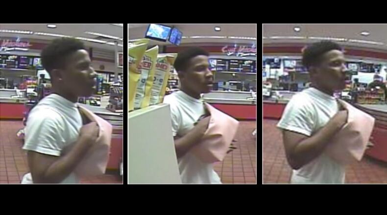 Gwinnett County police are looking for this man and two other people in connection with a robbery.