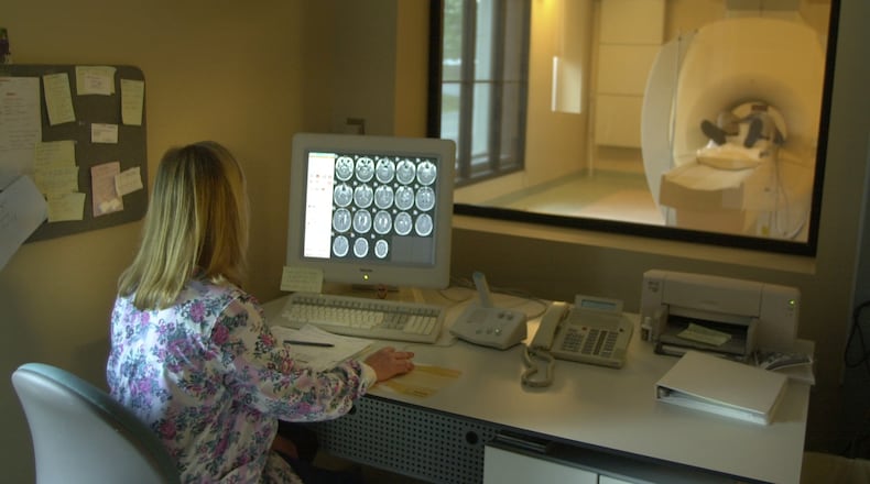 A technician at Rockdale Hospital performs an MRI. (PHOTO by Brant Sanderlin/AJC)