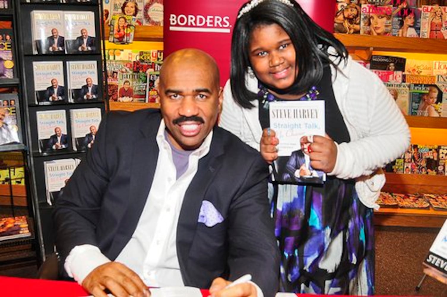 Steve Harvey signs his book 'Straight Talk, No Chaser'