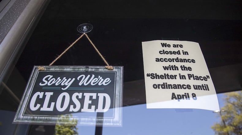 A closed sign is displayed on a storefront downtown Rome. Some businesses are suing their insurance carriers over covering their losses because of virus-reated closings. ALYSSA POINTER / ALYSSA.POINTER@AJC.COM