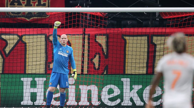 Atlanta United goalkeeper Brad Guzan salutes Josef Martinez after he scores the MLS season tieing record goal number 27 against the Columbus Crew in a MLS soccer match on Sunday, August 19, 2018, in Atlanta.  Curtis Compton/ccompton@ajc.com