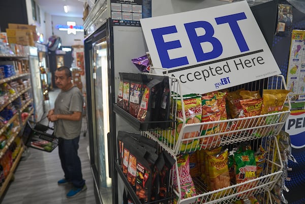 A banner reads "EBT (Electronic Benefit Transfer) Accepted Here," at El Recuerdo Market in Los Angeles. (Damian Dovarganes/AP)