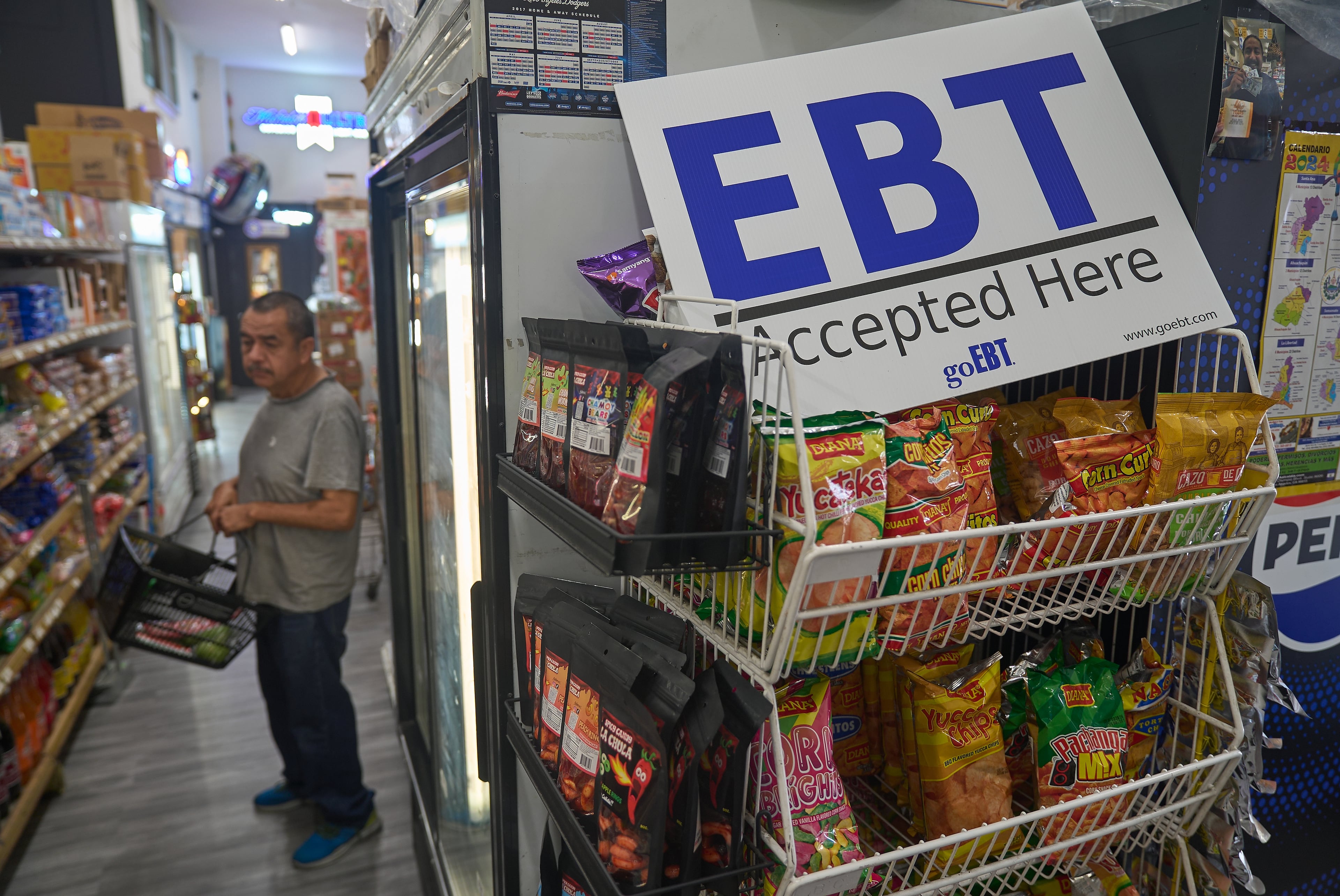 A banner reads "EBT (Electronic Benefit Transfer) Accepted Here," at El Recuerdo Market in Los Angeles. (Damian Dovarganes/AP)